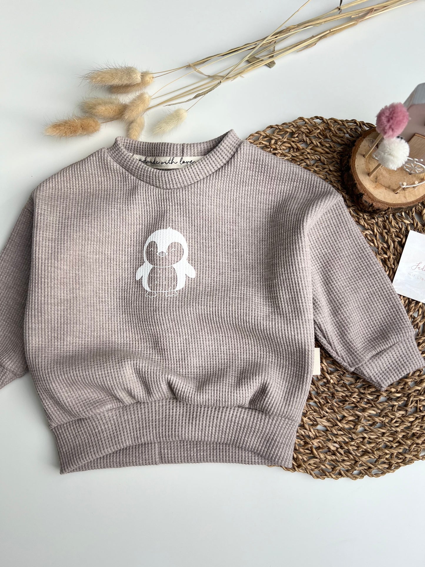 Lässiger Pinguinpullover
