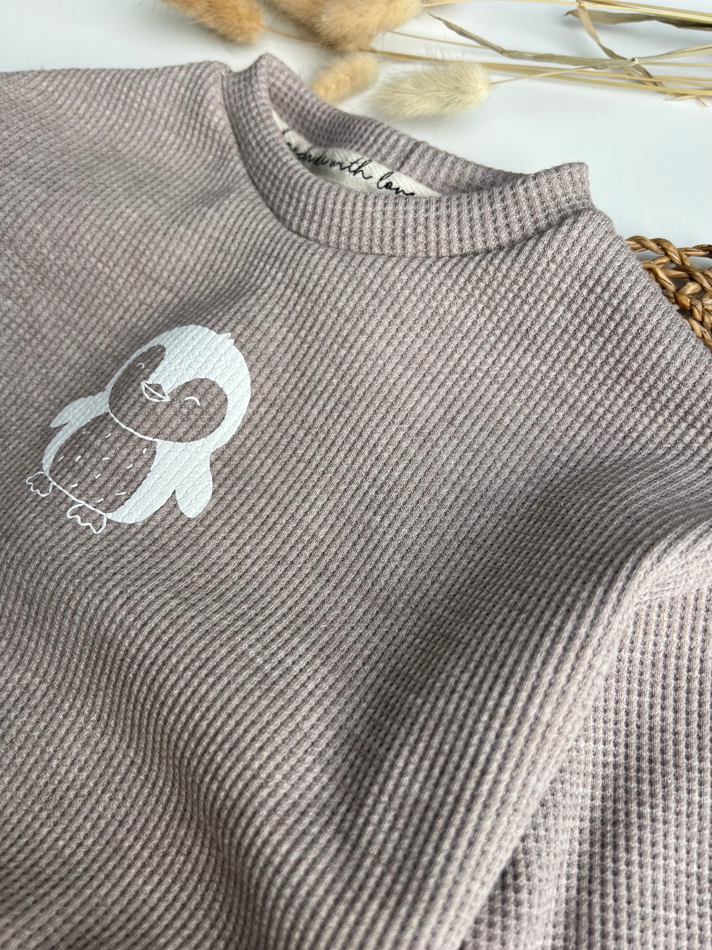 Lässiger Pinguinpullover